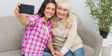 smiling-portrait-senior-woman-mother-taking-selfie-mobile-phone
